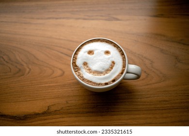 Cup of cappuccino coffee delicious hot coffee with foam milk and smile on color background, top view. Happy morning, good mood, inspiration - Powered by Shutterstock