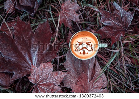 cup of cappuccino coffee with a stormtrooper pattern on milk crema
