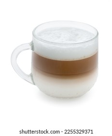 Cup of cappuccino with milk, layered coffee in glass mug isolated on a white background, close up.