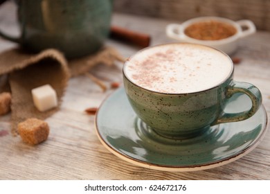 Cup of Cappuccino on wooden table