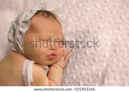 Similar – Image, Stock Photo Baby lies on a blanket and covers his eyes with his hands