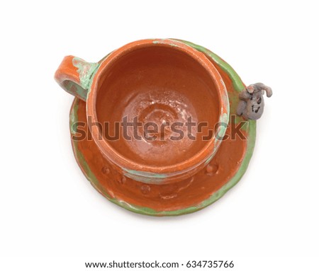 Cup with ceramic saucer on white background
