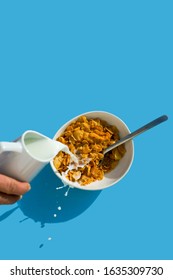 Cup With Cereal And Milk On A Blue Background