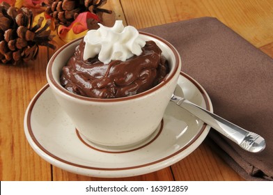 A Cup Of Chocolate Pudding With Whipped Cream