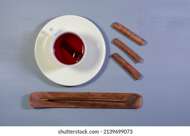 A Cup Of Cinnamon Tea And Cinnamon Sticks. Overhead Shot