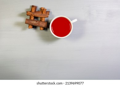 A Cup Of Cinnamon Tea And Cinnamon Sticks. Overhead Shot