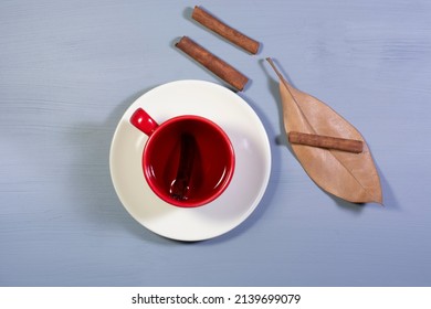 A Cup Of Cinnamon Tea And Cinnamon Sticks. Overhead Shot