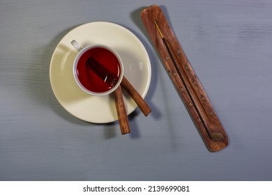 A Cup Of Cinnamon Tea And Cinnamon Sticks. Overhead Shot