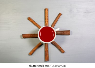 A Cup Of Cinnamon Tea And Cinnamon Sticks. Overhead Shot