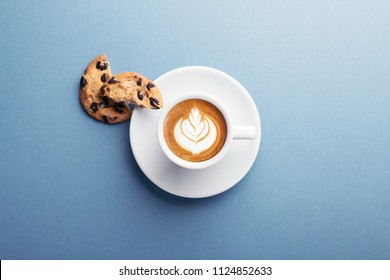 A cup of coffee and american cookies with chocolate chips on grey background. Top view. - Powered by Shutterstock