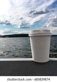 Cup Of Coffee In The Background Of The Lake