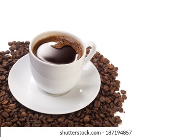 Cup Of Coffee With Beans From Above On White Background