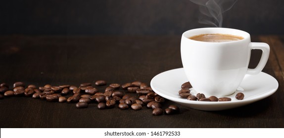 cup-coffee-beans-on-table-260nw-1461792533.jpg