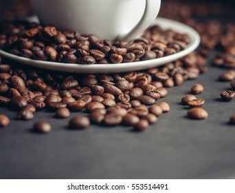 cup with coffee beans on the table