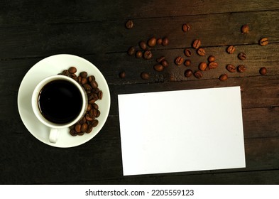 A Cup Of Coffee With Coffee Beans On Wooden Table.Flatlay, Mock Up