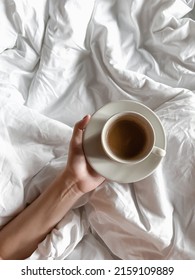 The Cup Of Coffee In The Bed