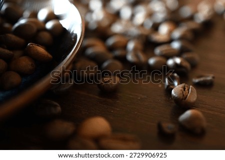 cup of coffee between coffee beans