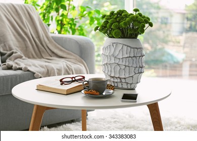 Cup of coffee with biscuits on table in room - Shutterstock ID 343383083
