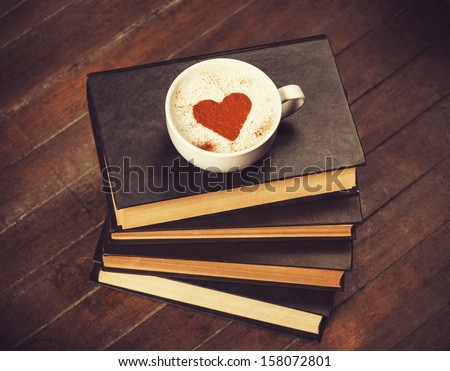 Cup of coffee with books