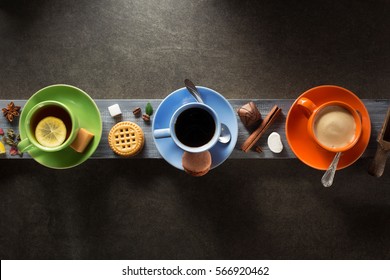 cup of coffee, cacao and tea on wooden background - Powered by Shutterstock