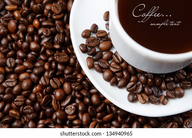 Cup with coffee, costing on coffee grain - Shutterstock ID 134940965