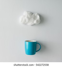 Cup Of Coffee With Cotton Wool Cloud. Flat Lay. Weather Concept