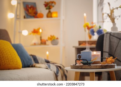 cup of coffee in cozy interior with autumnal decor - Shutterstock ID 2203847273