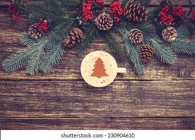 Cup Of Coffee With Cream Christmas Tree On A Table.