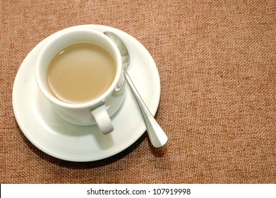 A Cup Of Coffee With Creamer