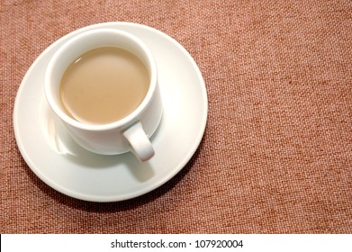 A Cup Of Coffee With Creamer