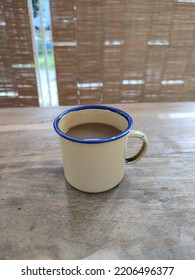 A Cup Of Coffee With Creamer