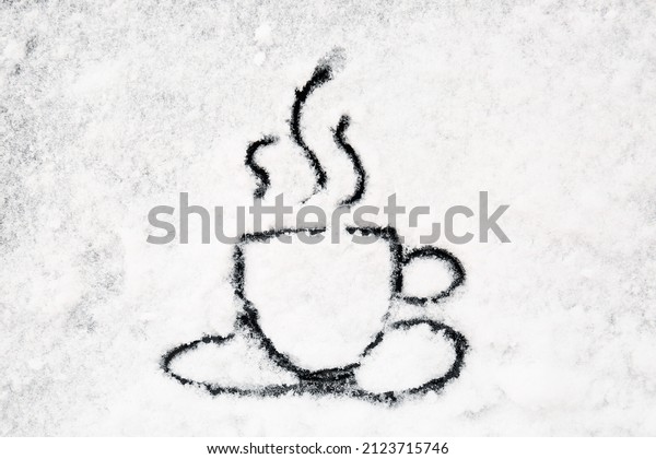 Cup of\
coffee drawn on car window covered with\
snow