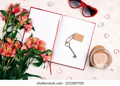 A cup of coffee, an empty notebook, a bouquet of flowers and glasses on a light marble table. Romantic planning concept. Flat lay, top view, copy space.