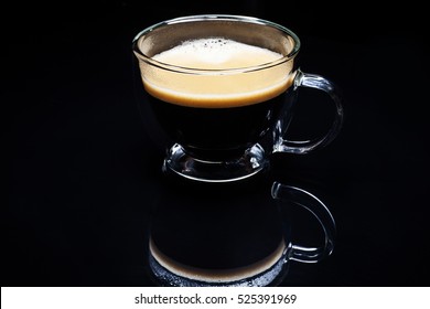 A Cup Of Coffee Espresso On Black Background With Coffee Capsule.