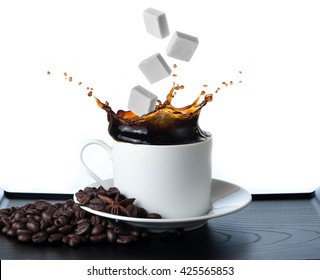 Cup Of Coffee With Falling Sugar Cube  Isolated On White Background