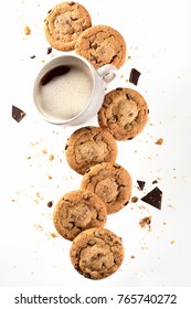 Cup Of Coffee With Flying Cookies. Chocolate Chips Falling In Motion 