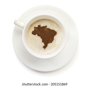 A Cup Of Coffee With Foam And Powder In The Shape Of Brazil.(series)