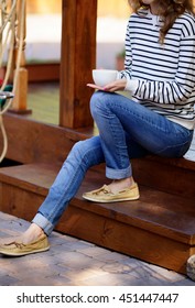 Cup Of Coffee In Hands Woman Which Sits On The Wooden Steps The Porch