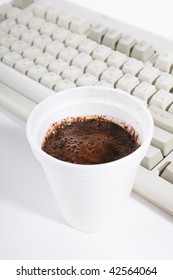   cup of coffee and keyboard