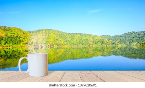 Cup Of Coffee With The Lake And Mountain View Background