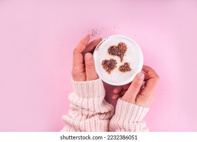 Cup with coffee latte with heart decoration. Heart Shape Coffee Art on coffee or hot chocolate drink, in woman hands on pink background. Valentine day, birthday, woman day greeting card background - Powered by Shutterstock