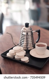 Cup of coffee with macaron 