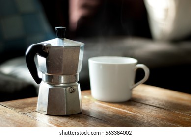 Cup Of Coffee With Mock Pot Home Coffee Maker In Morning Living Room