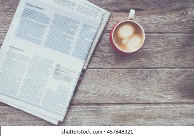 cup of coffee with Newspaper in coffee shop.  - Powered by Shutterstock