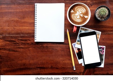 cup of coffee and note paper on the wood texture background