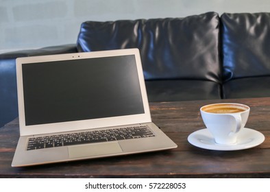 cup of coffee and notebook on table