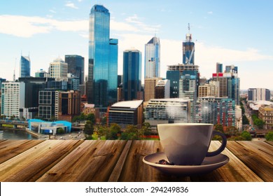 Cup Of Coffee On Abstract City Background