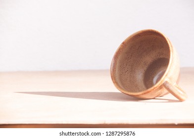 Cup Of Coffee On Art Wooden Table With Sunlight And Shadow No More Coffee