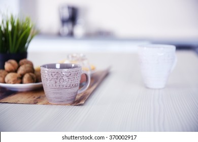 Cup Of Coffee On Cotton Napkin In The Kitchen, Close Up