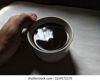 A Cup Of Coffee On A Dark Cloudy Day